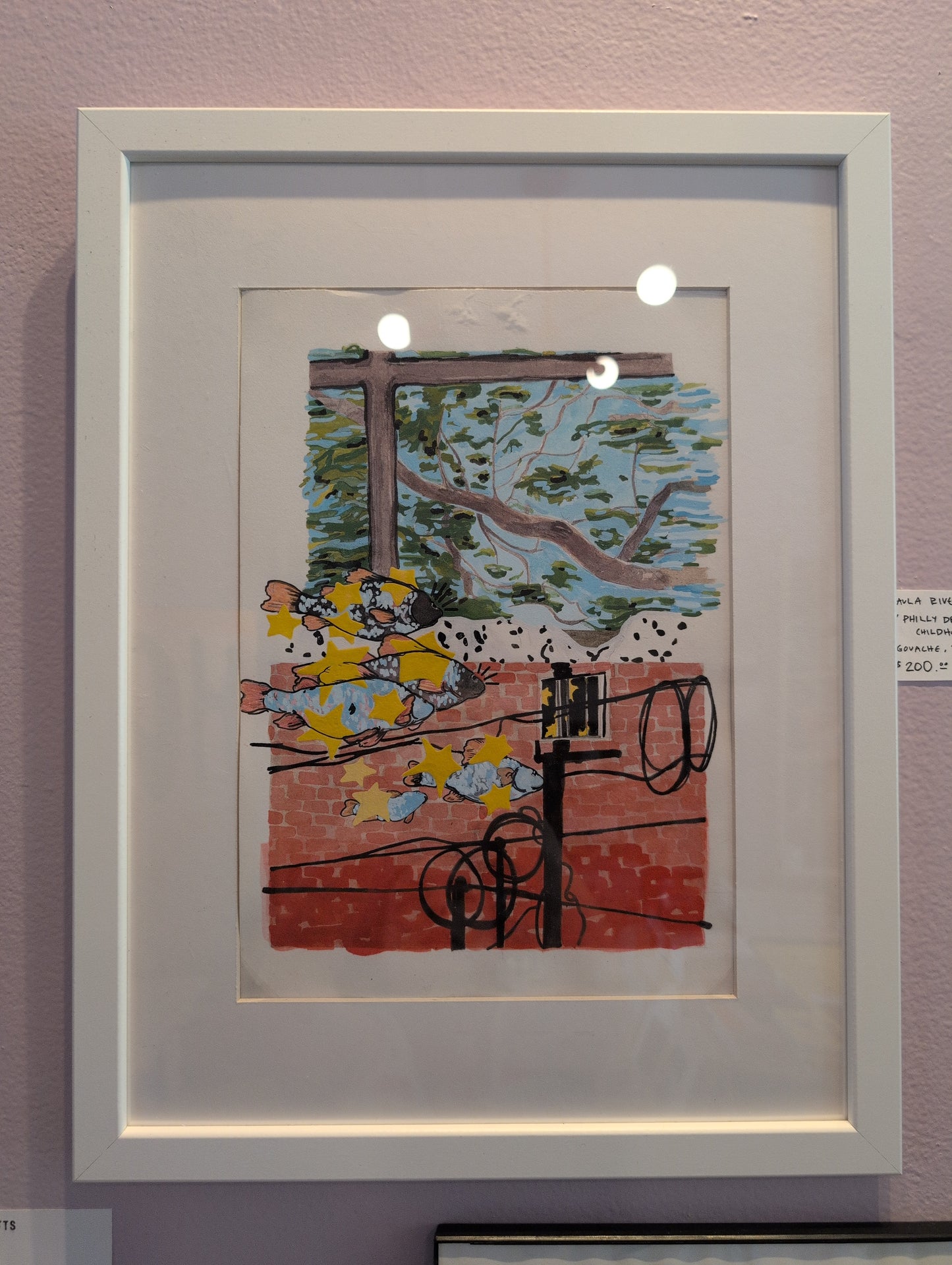 Framed artwork with a colorful scene of people and trees on a pink wall.